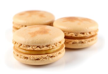 Golden Macarons Trio: A trio of delicate, golden-hued macarons, each a testament to the art of French pastry, rests temptingly in the scene