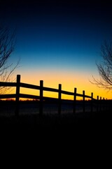 Sunset Silhouette of a Fence