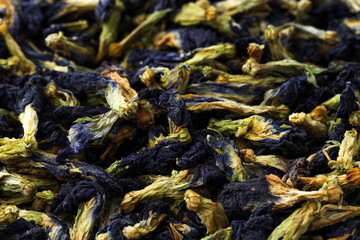 Butterfly pea flower tea. Dry Clitoria ternatea petals as background, closeup