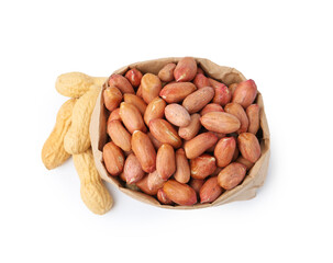 Fresh peanuts in paper bag and unpeeled ones isolated on white, top view