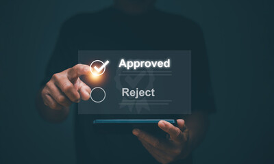 Project approval consideration concept. Businessman pointing at correct mark for document or...