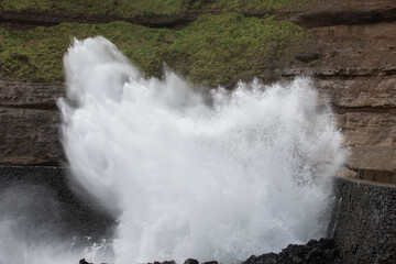 Stormy waves crashing against rocks on the Atlantic coast of Portugal on the island of Madeira