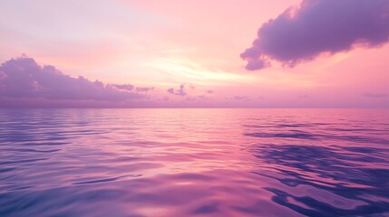 Obraz premium Endless Ocean Mirrors the Enchanting Pink and Purple Sunset Sky