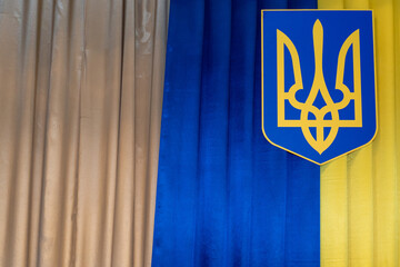Ukrainian national emblem displayed on a blue and yellow background