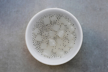 Coconut jelly with basil seeds in syrup