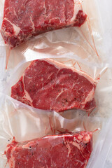 Raw beef steaks vacuum sealed and ready for sous vide