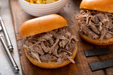 Pulled pork sandwiches on brioche buns with BBQ sauce and cabbage