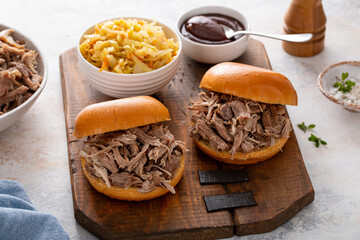 Pulled pork sandwiches on brioche buns with BBQ sauce and cabbage