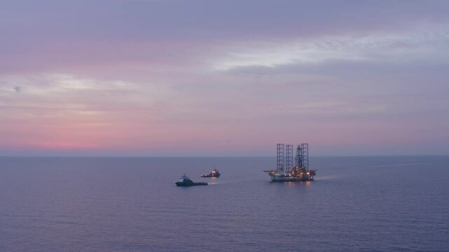 Aerial view of an offshore jack up drilling rig during sunset - oil and gas upstream industry
