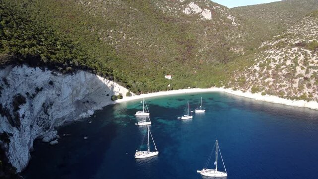 Aerial view of the sailing boats anchored off the shore of the Ionian island of Atokos, Greece