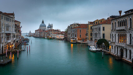 A scenic view of the Grand Canal in Venice, Italy during twilight.
