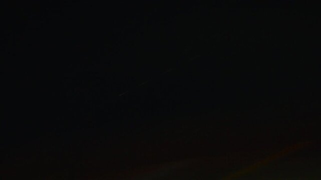 Dynamic Whip Pan Capturing Blurred City Night Lights