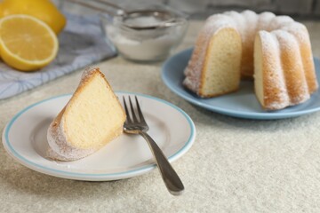 Piece of delicious lemon cake with powdered sugar and fork on light textured table, closeup