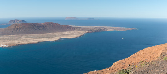 Aerial panoramic view of the volcanic island La Graciosa north cape coast, in Atlantic ocean, from...