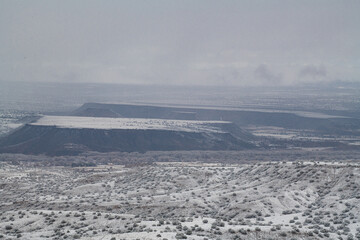 volcanic mesas topped with snow