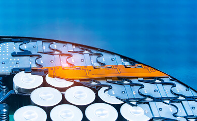 Metal parts with shiny steel cylindrical surface closeup. disassembled lithium ion form factor cell...