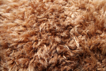 Brown plush fabric close-up abstract textured background