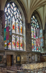 Flags of Knights of the Thistle hang in the interior of St Giles Cathedral. Edinburgh. Scotland