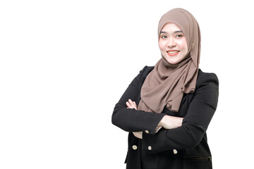 Smiling cute young asian muslim woman in hijab light clothes posing isolated on white background studio portrait. People religious Islam lifestyle concept. Mock up copy space. Holding hands crossed