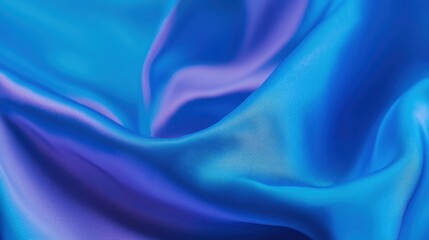 Obraz premium Soft and shiny fabric in blue tones gently folds, creating an elegant display of color variations and texture