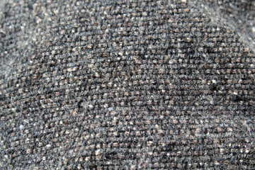 Grey gray nubby bumpy fabric material close-up abstract background