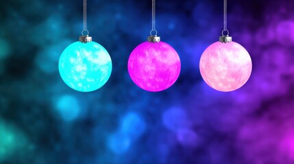 Fototapeta premium Three Vibrant Glowing Christmas Ornaments in Teal Fuchsia and Rose Hang Against Blurry Brightly Lit Background Scene