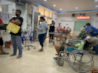Fototapeta premium Blurred image of patient, wheelchair, in hospital, waiting to see doctor.