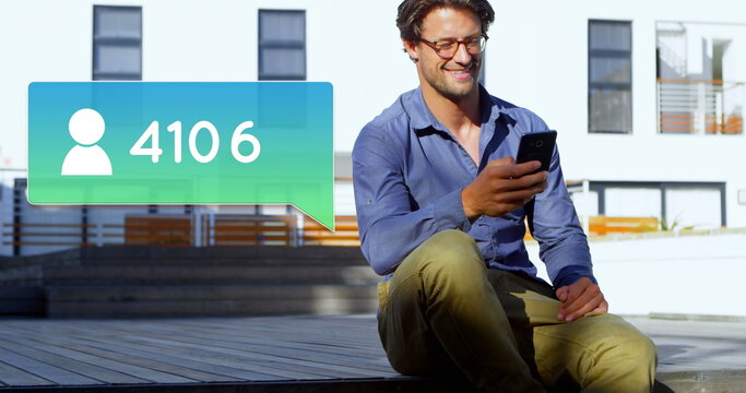 Smiling man using smartphone outdoors, social media follower count increasing