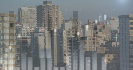 City skyline with digital graphs overlaying buildings, representing financial growth