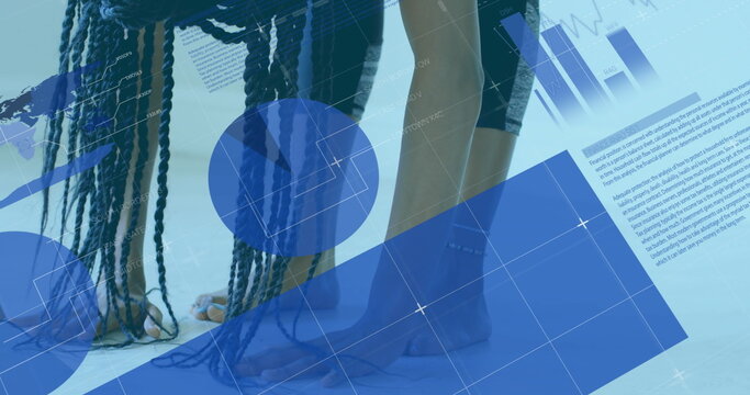 Exercising at home, woman stretching on yoga mat with digital overlay graphics