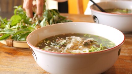 Nutritious Asian dish with steaming pho with basil and aromatic spices Healthy concept showing vibrant flavors wholesome ingredients and culinary tradition for mindful lifestyle and balanced diet