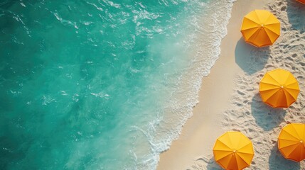 Aerial view of beach with yellow umbrellas. Turquoise water and white sand. Stock photo for travel