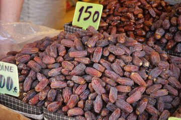 Freshly harvested dates for sale at a local market stall in autumn