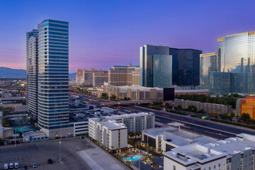 Las Vegas, USA: Aerial view of the city skyline at dusk, featuring modern architecture. Captures the vibrant cityscape and urban development.