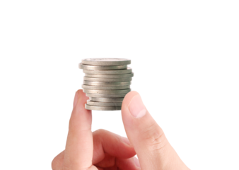 Counting coins hand holding stacked coins indoor setting close-up view financial concept for savings and investments