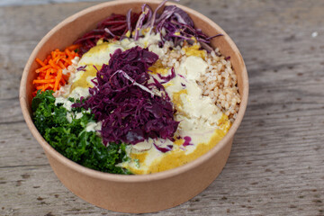 Vegan Buddha Bowl - A hearty bowl made with brown rice or quinoa and topped with roasted sweet potatoes, chickpeas, carrots, kale, red cabbage
