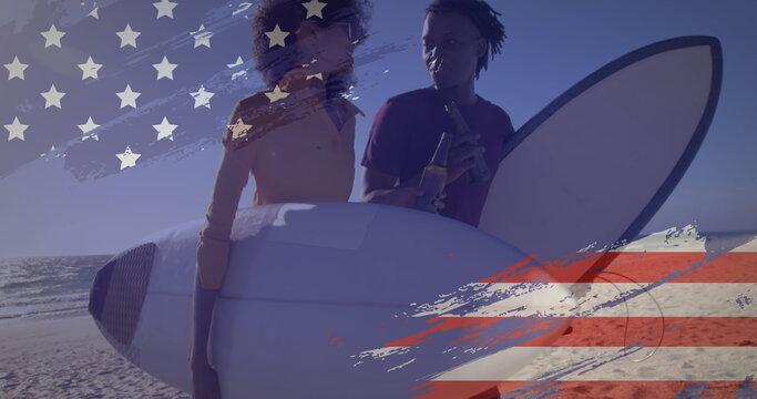 Naklejki Image of american flag drawn over biracial couple by seaside on summer holiday