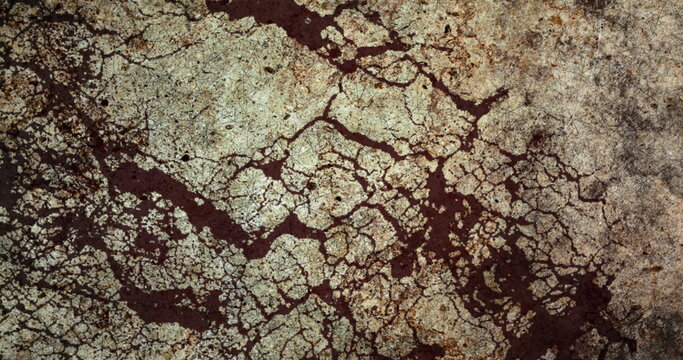 Image of brown and grey distressed cracked pattern moving in repetition in seamless loop