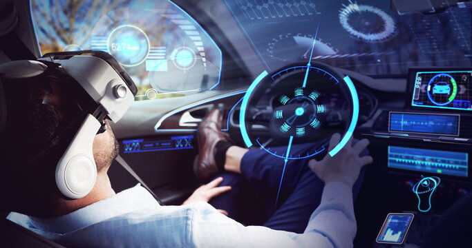 Image of screen over businessman wearing vr headset in self driving car - Powered by Adobe