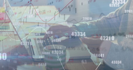 Image of numbers changing and financial data processing over man paying online using laptop