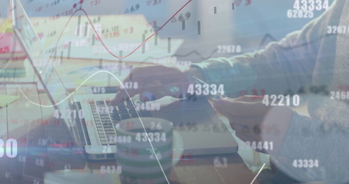 Image of numbers changing and financial data processing over man paying online using laptop