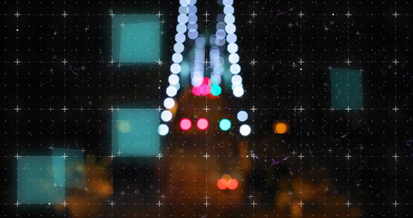 Digital image of scope scanning over bokeh lights against night city traffic