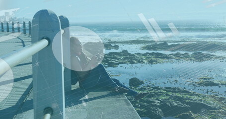 Statistical data processing against african american woman holding digital camera on promenade