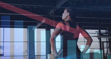Image of statistics and graphs over woman exercising in an abandoned building