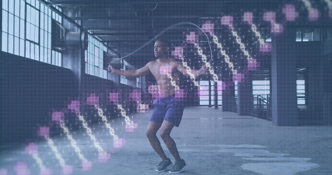 Digital composite image of dna stricture spinning against african american man jumping rope