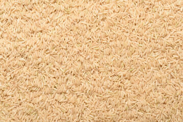 Texture background of brown rice grains from local agricultural in Thailand