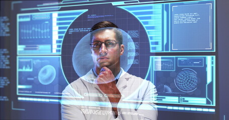 Image of male scientist behind interactive computer screen with medical data processing
