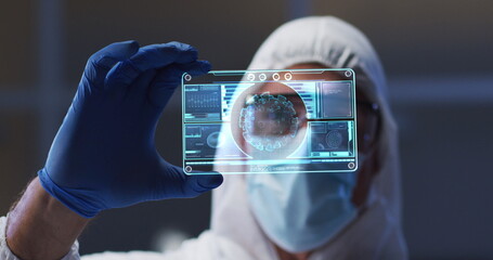 Image of male scientist holding interactive screen with medical data processing