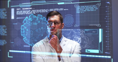 Image of male scientist behind digital screen with covid 19 cell and medical data