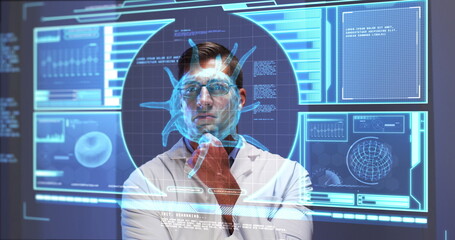 Image of male scientist behind digital screen with covid 19 cell and medical data